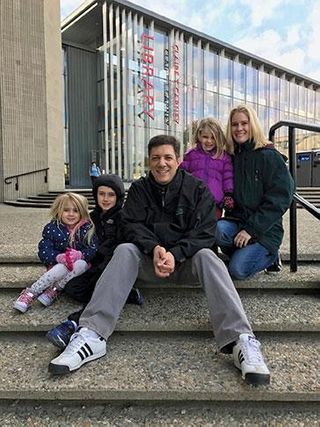 Roxanne Leone '94, right, and husband Michael Leone '94, and their children - on the UMass Dartmouth campus