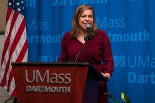 Sofia Reppucci speaking at the podium, MLK Breakfast 2017