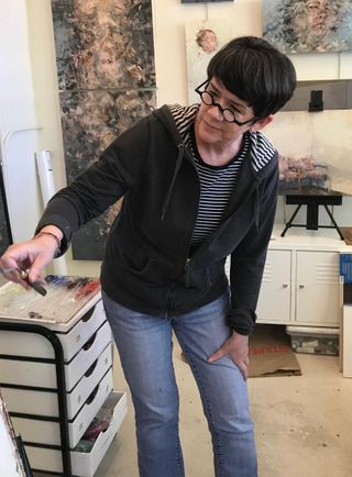 Artist Lisa Bryson (MFA '17) working in her studio