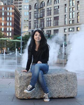 Mariah Tarentino sitting in front of a fountain