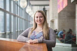 Samantha Reid posing in the library