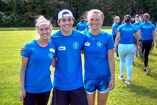 3 first-year nursing students standing outside during the obstacle course