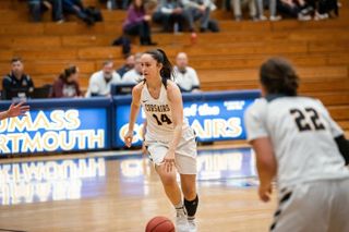Kayla McMahon '20 action shot Kayla McMahon '20 playing basketball