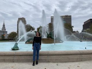 Hannah Gadbois standing in front of a fountain