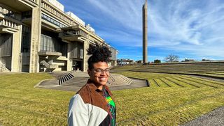 Health & Society major Gabriel Johnson pictured in the amphitheater