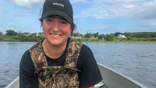 SMAST student Elizabeth Ells on her boat