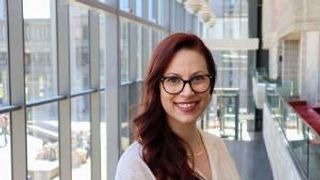 Kathryn Grande '23 pictured in the Claire T. Carney Library