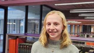 Senior art history major Kayla Rausch '23 pictured in the Claire T. Carney Library