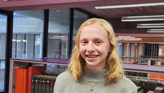 Senior art history major Kayla Rausch '23 pictured in the Claire T. Carney Library