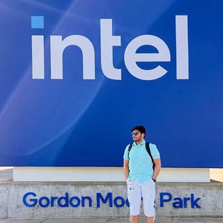 ECE student Abhishek Bhattiprolu standing in front of the Intel logo