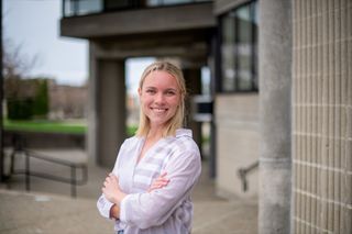 Student Maggie McCafferty standing outside the UMassD library