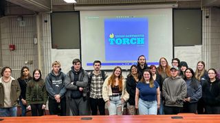 Members of The Torch pose at the first team meeting of the spring semester 2024.