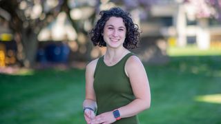Political science and 3+3 law student Sara Donahue standing on the campus quad