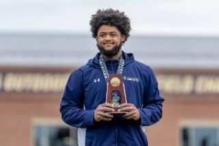 Ancil Alexander pictured with his All-American medal and trophy at the 2026 Track & Field National Championships