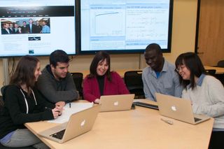 Sigal Gottlieb working with grad students at UMass Dartmouth's Center for Scientific Computing and Visualization Research (CSCVR).