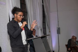 UMassD student, Gabriel Johnson, addresses the attendees