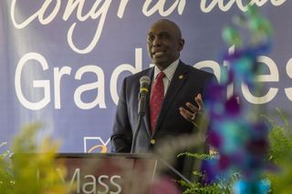 Chancellor Johnson speaking at a podium