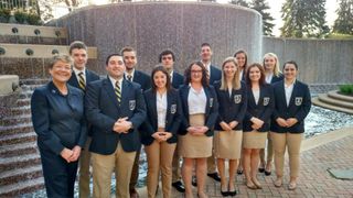 DECA Chapter Advisor Jacqueline Einstein with UMassD DECA student participants.