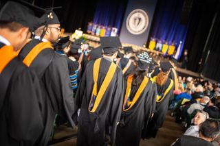 Students walking in during 2018 Commencement