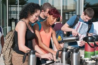 Students pouring coffee