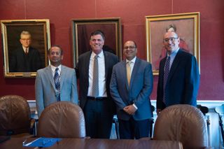 Administrators posing after signing contract