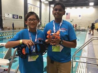 Two students from Texas with their robot