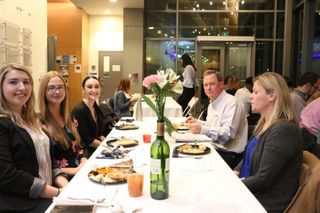 Students at bi-annual market research dinner