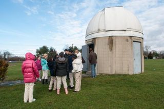 Crowd gathers at UMassD Observatory