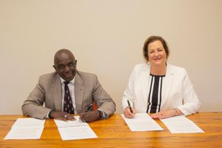 Chancellor Johnson and President Douglas sign agreement