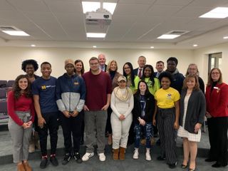Students and legislators posing at America Reads event