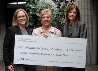 Staff recieving large check