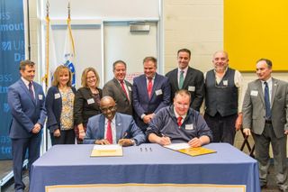 Town and University officials signing Dartmouth Town/Gown Compact