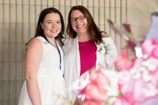Nursing student and faculty member standing together after 2019 Pinning Ceremony