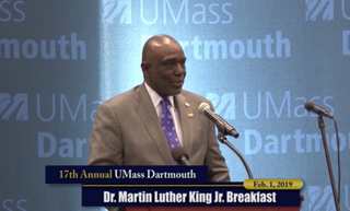 Chancellor Johnson speaking at podium