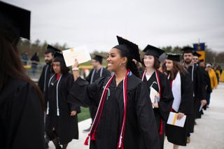 Student graduating in regalia