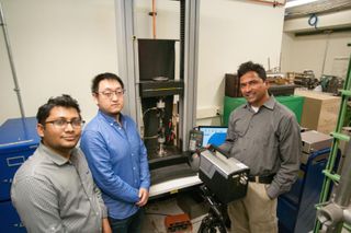 Mechanical Engineering Professor Dr. Vijaya Chalivendra and students in his lab