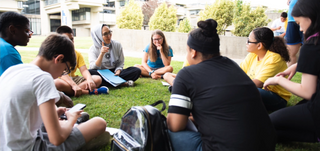 Students gathered on lawn for class