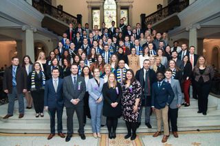 Large group of UMass Law students and faculty