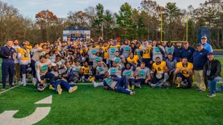 Football team holding trophy