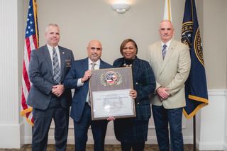 Group shot of Police Officers holding award