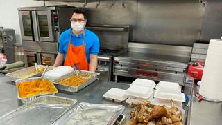 Diego Marroquin volunteering serving food