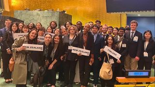 Twenty members of the UMassD Model UN team and 14 students from Japanese universities pose for a picture after winning outstanding delegation in New York City.