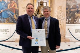 Brian Baptiste and Chris Markey posing with award