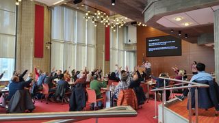 UMassD faculty gathered in the grand reading room