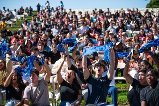 students wave bandanas at new student convocation