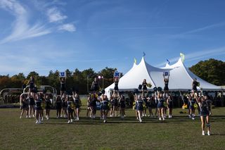 UMassD Cheerleaders performing at Alumni Tent
