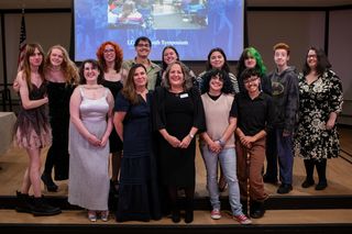 Students, faculty, staff, and alumni posing for a photo