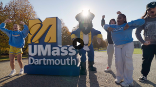 Students gathered around the mascot arnie