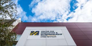 Center for Innovation and Entrepreneurship logo on building with blue sky shown