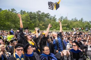 Students tossing their caps after the culmination of Commencement 2026.